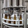 BFL-MB2000TP : Automatic counter pressure filling line for 2000 bottles per hour with a tunnel pasteurizer