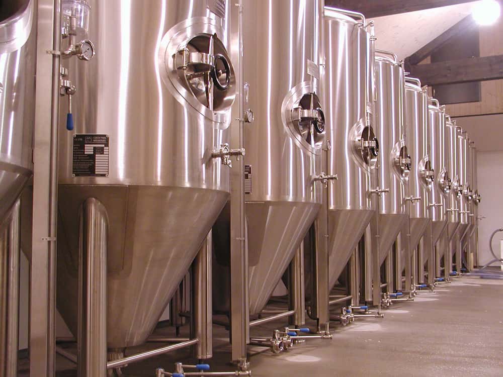 Cylindrically-conical fermentors in a brewery